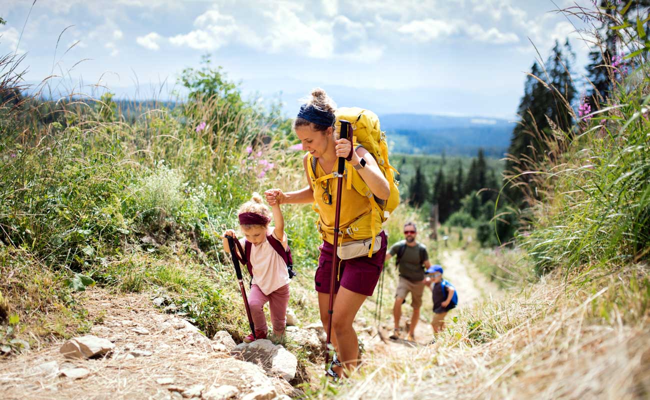 Family with small children hiking outdoors in summer nature, walking in High Tatras. Family with small children hiking outdoors in summer nature, walking in High Tatras.